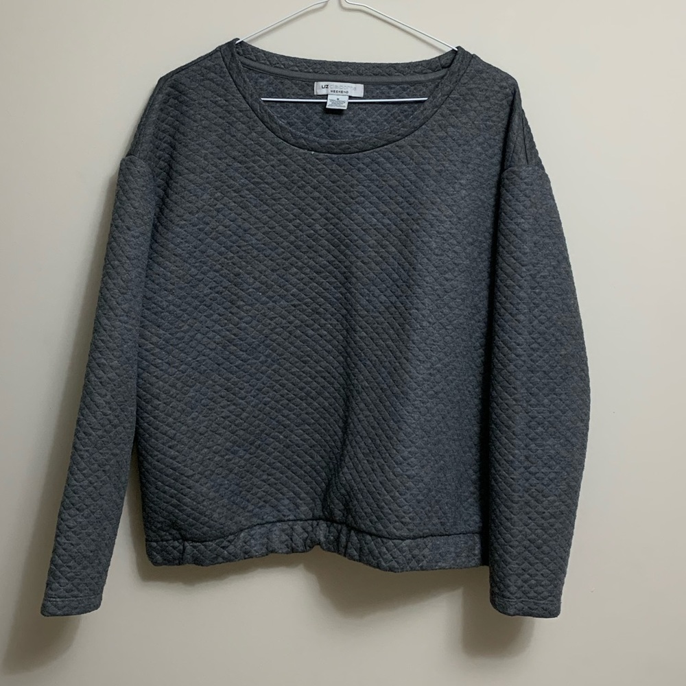 Grey quilted sweater with gold speckle detailing.